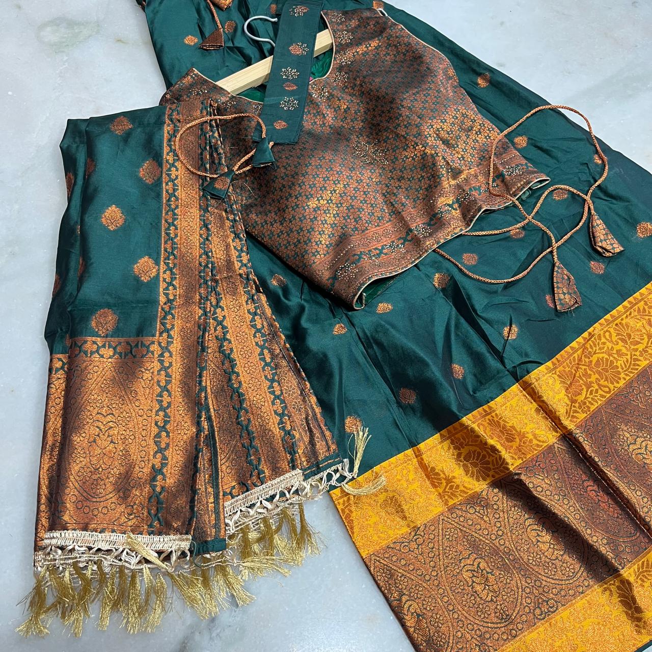 Regal emerald green lehenga set with a richly woven chloi,dupatta & belt