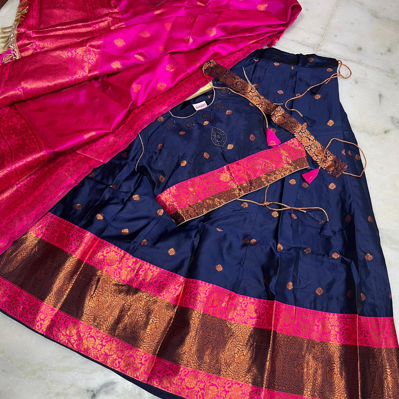 Traditional navy blue lehenga with a striking pink zari dupatta & belt