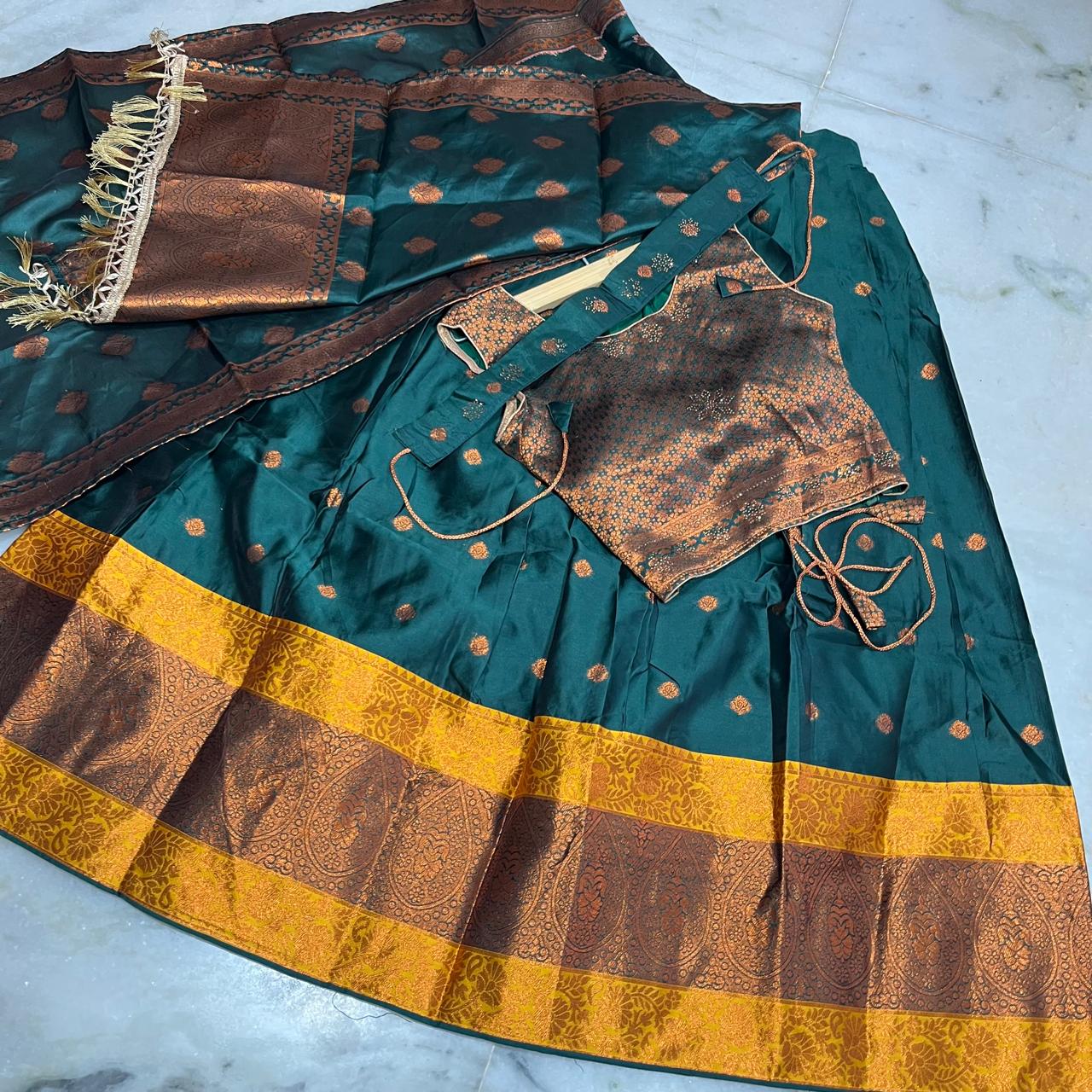 Regal emerald green lehenga set with a richly woven chloi,dupatta & belt